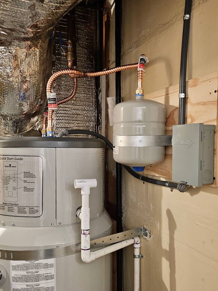Copper line work, thermal expansion tank and electrical disconnect fitted above a water heater